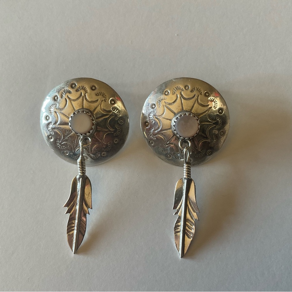 Silver western style earrings.